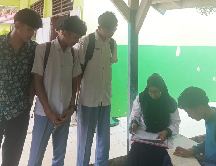 Ujian Kompetensi Keagamaan Bidang Tajwid Kelas XII di MAN 2 Bungo : Mengasah Ketepatan dan Keindahan Membaca Al-Quran